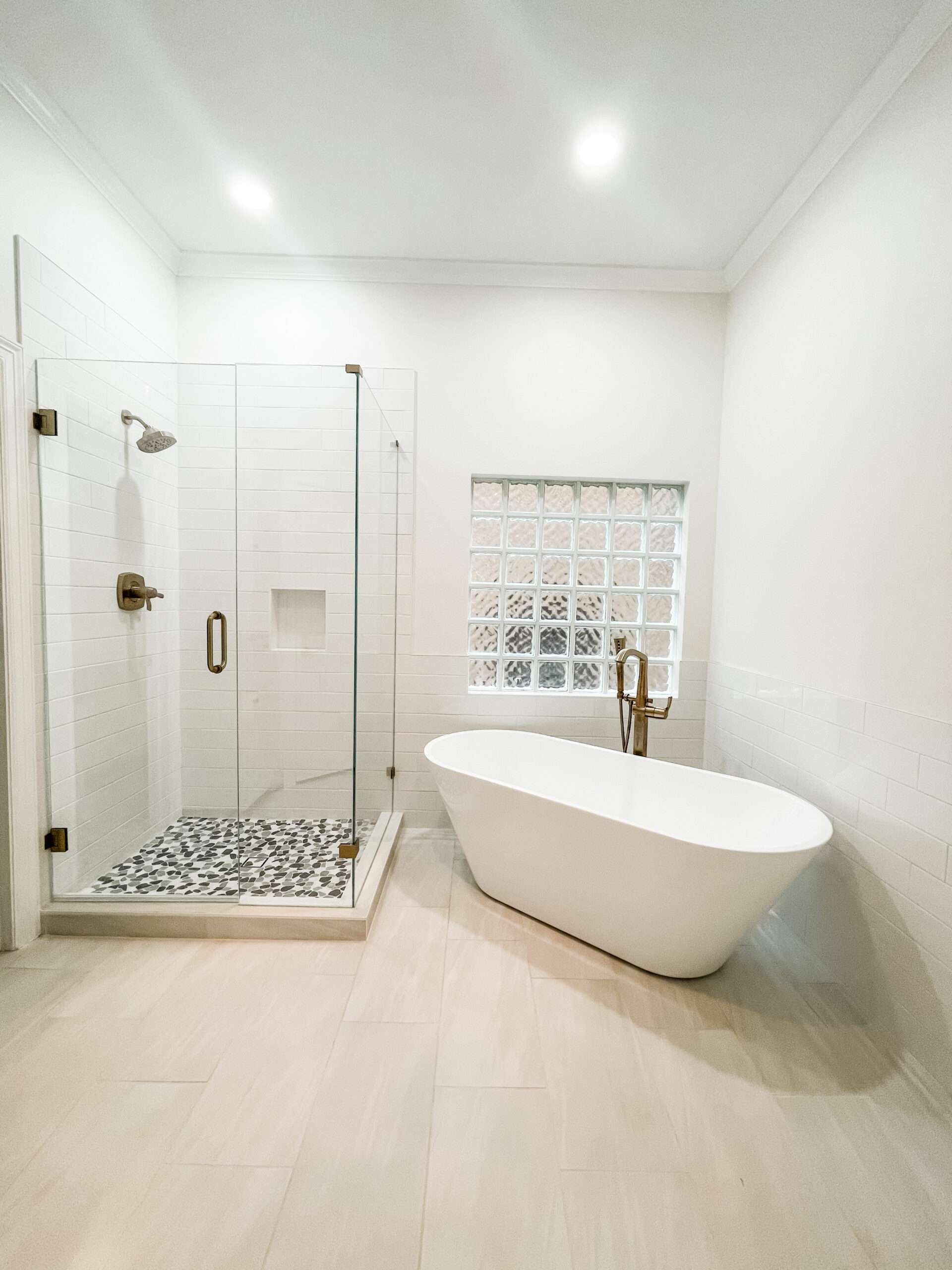 Modern accessible bathroom remodel with walk-in shower and freestanding tub Austin TX